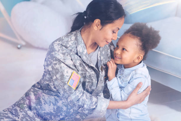 istock Pleasant attractive woman looking at her daughter 907615032