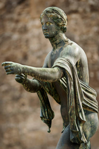 Apollo God statue in Apollo Temple, Pompeii Apollo Temple in Pompeii, bronze of the god Apollo in the ancient city Pompeii destroyed by the eruption of Vesuvius in the year 79 BC. during the rule of Roman Emperor Vespasian crop top view stock pictures, royalty-free photos & images