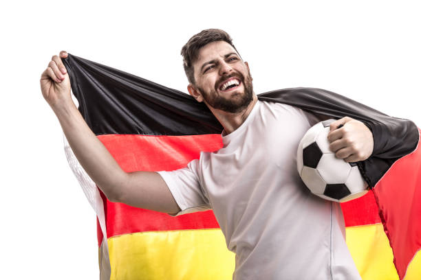 istock German male athlete / fan celebrating on white background 907618188