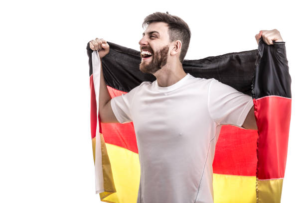 istock German male athlete / fan celebrating on white background 907618226
