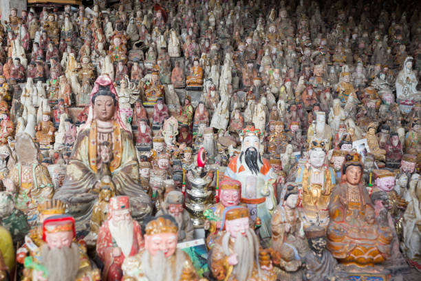 istock Buddhist and Taoism statue Large group of objects background 907626688