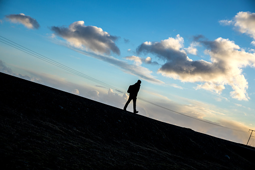 Solo traveler in Iceland, walking in the wild