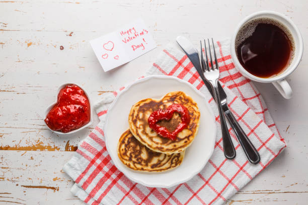 istock Breakfast for valentines day - pancaked, jam and coffee 907639270