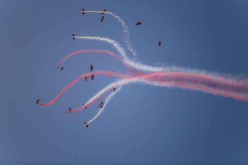 Doha, Qatar - December 18, 2017: perform of parachutists on Qatar National Day parade on the Corniche street, Doha, Qatar
