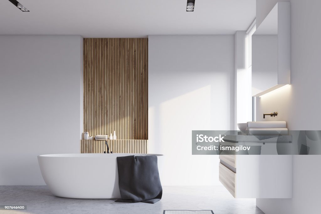 White and wooden bathroom, sink and tub White and wooden bathroom interior with a concrete floor, a white bathtub and a sink with a big mirror hanging above it. 3d rendering mock up Bathroom Stock Photo