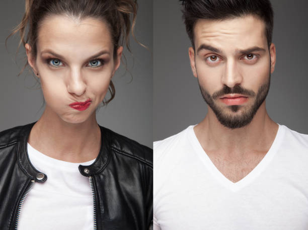 istock man and woman making funny faces 907648718