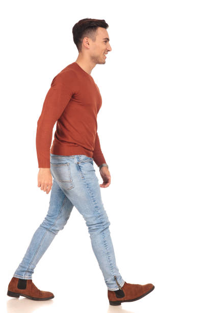 istock side view of a fit casual man walking 907648904