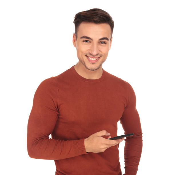 istock happy casual young man texting on his phone 907648974