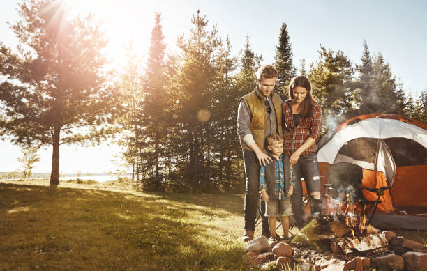 istock Happily camping with family 907649436