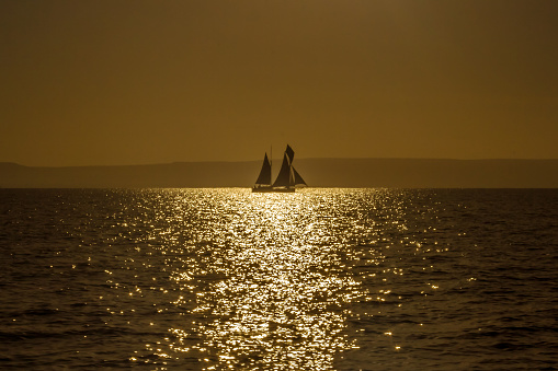 Malagasy dhow at golden hour off the coast of Anakao, southern Madagascar