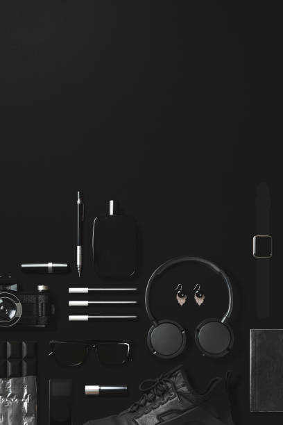 istock Black fashion and technology items flat lay on black background 907650142