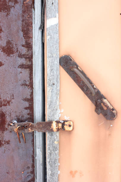 istock The old door is closed on the hook 907653954