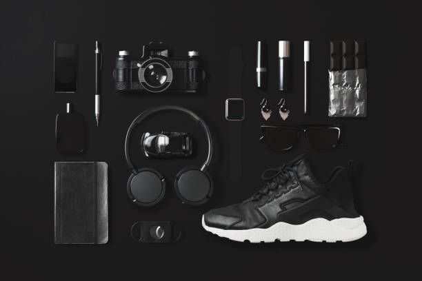 Black fashion and technology items flat lay on black background Black fashion and technology items on black background sports shoe photos stock pictures, royalty-free photos & images