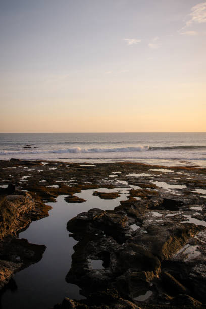 istock Rough Shore Lagoon at Sunset in Bali 907657034