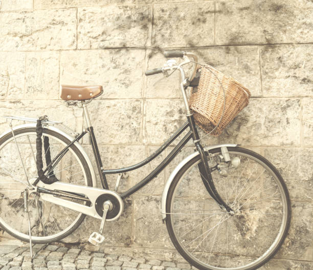 istock Retro bicycle on a empty street / alley. 907657202