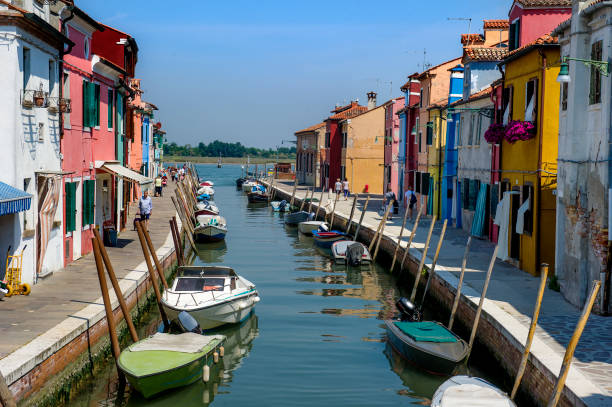 The Island of Burano near Venice, Italy, famous for its pretty multi-coloured fisherman's houses, canal's and eateries, is a magnet for tourists throughout the summer. The island rose in importance only in the 16th century, when women began making lace with needles, being introduced to such a trade via Venetian ruled Cyprus. Picture by Paul Heyes, Friday June 02, 2017