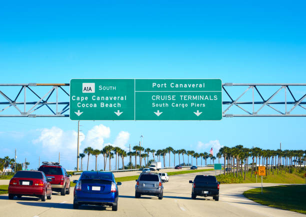 Cape Canaveral and Cocoa beach sign Florida Cape Canaveral and Cocoa beach road sign in florida near Orlando USA cocoa beach photos stock pictures, royalty-free photos & images