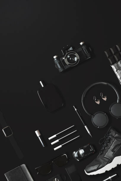 istock Black fashion and technology items flat lay on black background 907663062