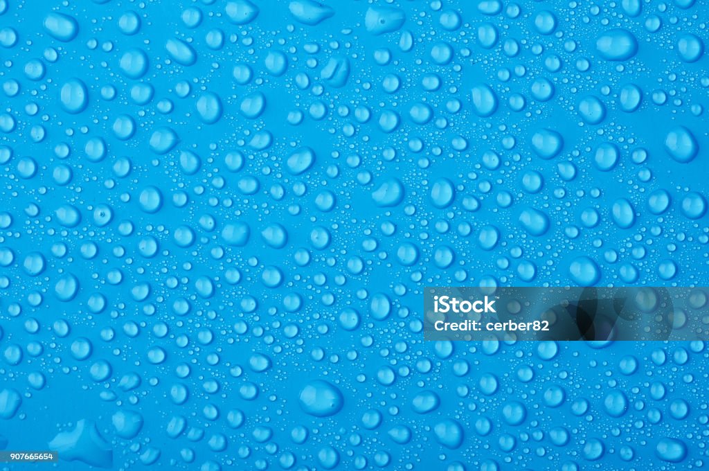 Water drops on a blue background Water Stock Photo
