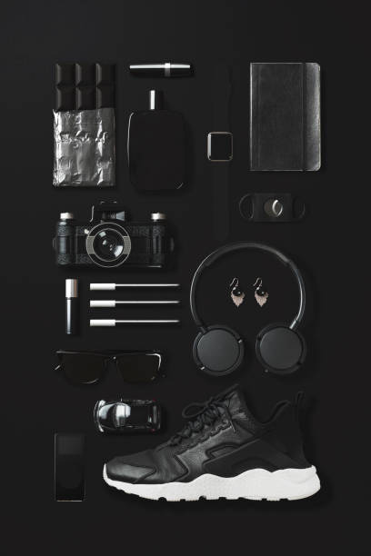 istock Black fashion and technology items flat lay on black background 907666058