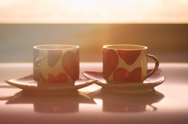 Sunny morning of Valentine's day begins with two mugs decorated with hearts