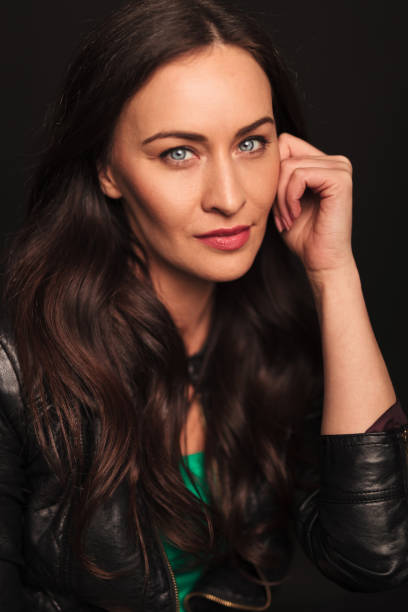 istock portrait smiling woman looking pensive 907666808