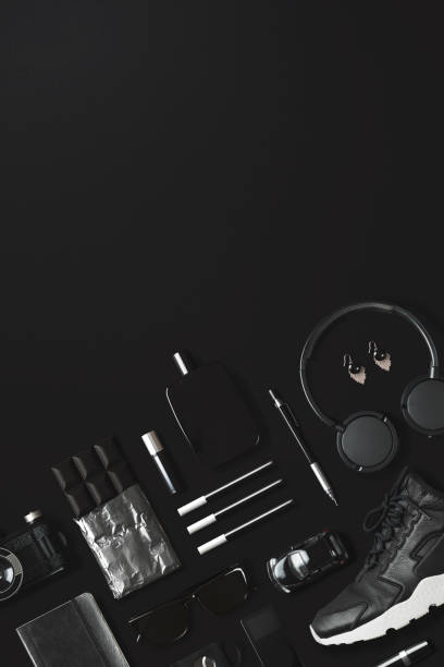 istock Black fashion and technology items flat lay on black background 907667006