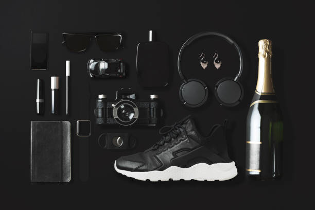 istock Black fashion and technology items flat lay on black background 907670142