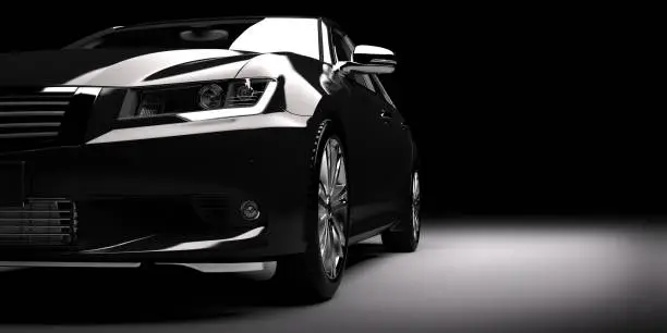 Modern new black metallic sedan car in spotlight. Generic contemporary desing, brandless. 3D rendering.