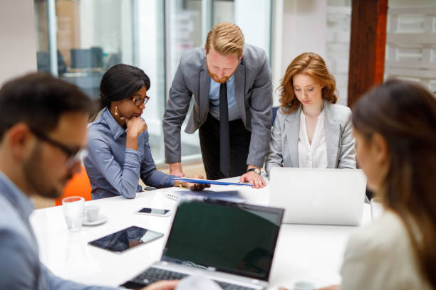 istock Business partners discussing documents and ideas during business meeting. 907676528