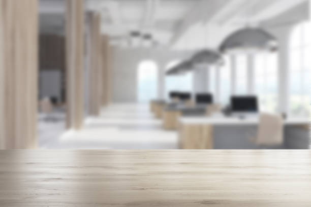 istock White modern office, arch windows, wood blur 907684328