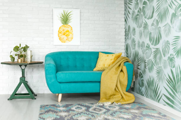 pineapple painting in apartment interior - vehicle interior green sofa indoors imagens e fotografias de stock