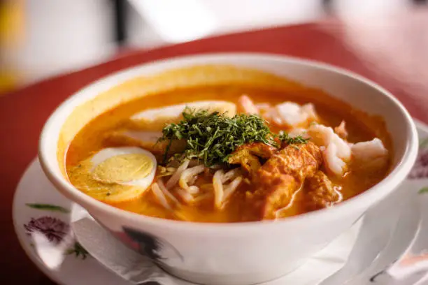 Singaporean Laksa Soup with coconut broth and seafood