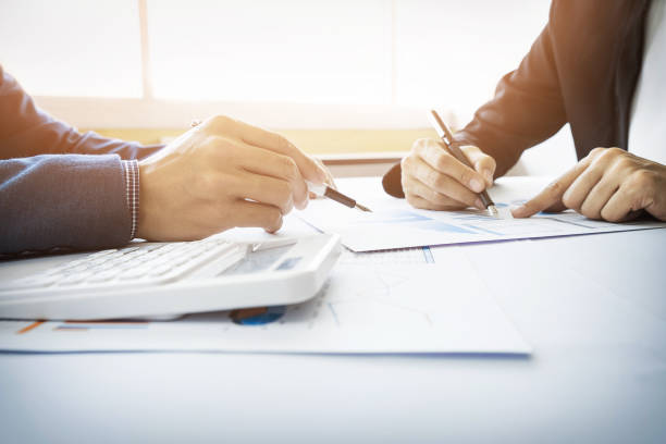 istock Business People Working At Table In Office 907693314