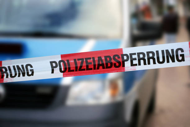 Police cordon tape with the german word „Polizeiabsperrung“ stock photo