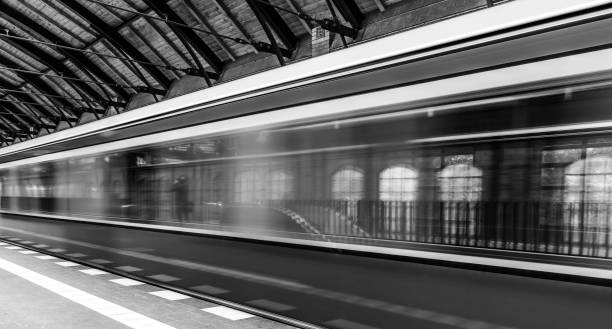 istock Blurred Motion Of Train At Railroad Station 907697964