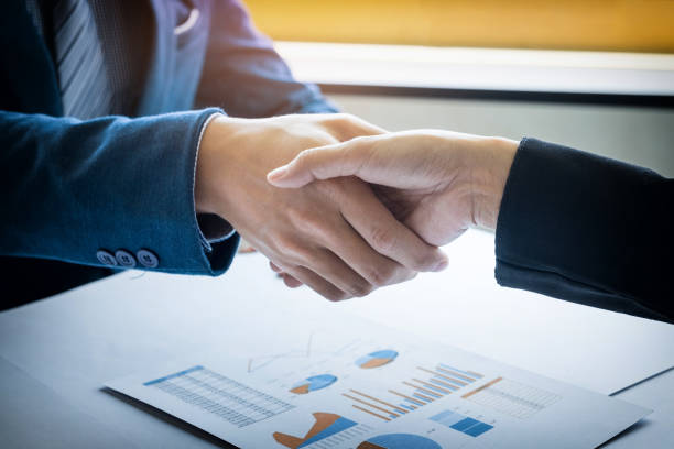 istock Business People At Desk In Office 907699222