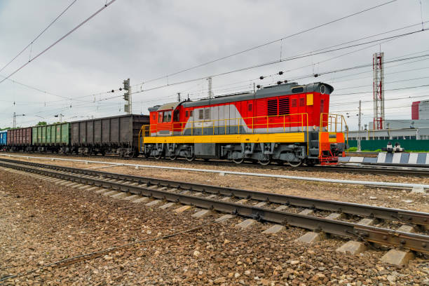 istock The locomotive pulls the wagons with a load. 907699750