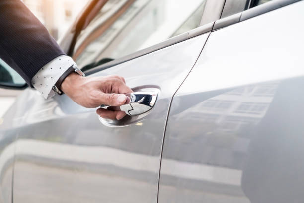 istock Cropped Image Of Hand Opening Car Door 907706860