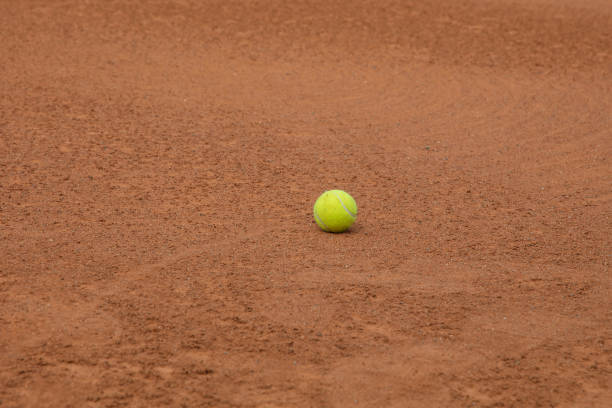 istock High Angle View Of Tennis Ball On Sand 907716212