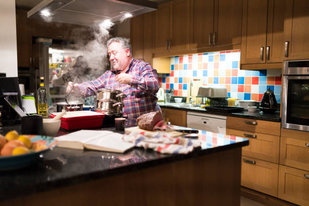 istock Family cooking sunday lunch 907729378