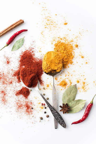 istock spoons with paprika and curry 907729504