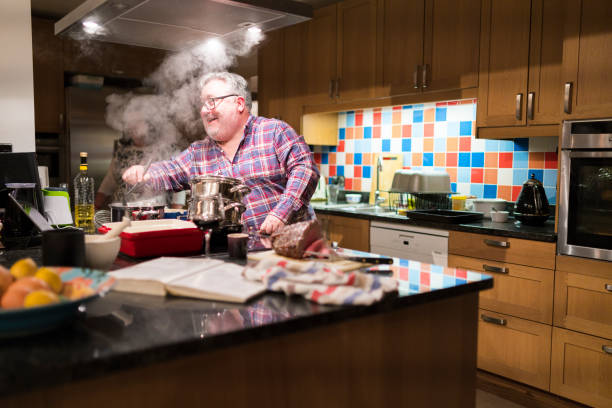 istock Family cooking sunday lunch 907729572