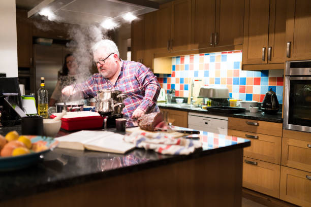 istock Family cooking sunday lunch 907729600