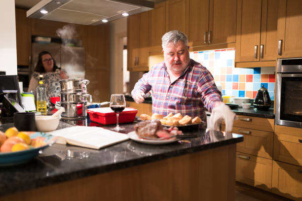 istock Family cooking sunday lunch 907729714