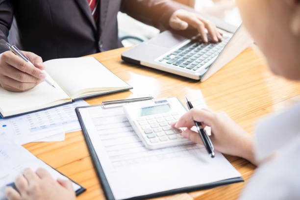 istock High Angle View Of Business People Working At Table In Office 907730428