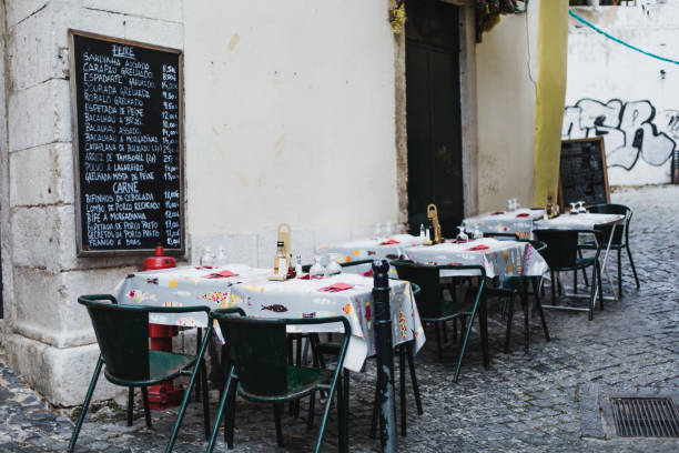 Empty sidewalk cafe in Alfama, Lisbon, November 1, 2017