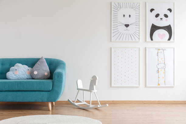 istock Rocking horse next to couch 907740112