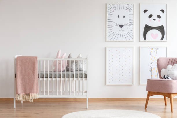 istock Crib in baby room 907740118