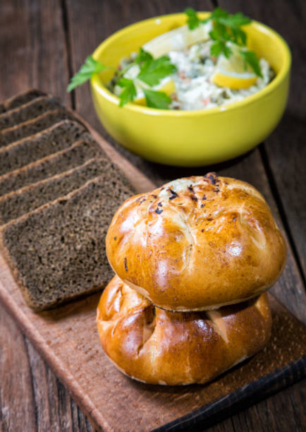 istock plate with salad and bread rolls at the village table 907740920